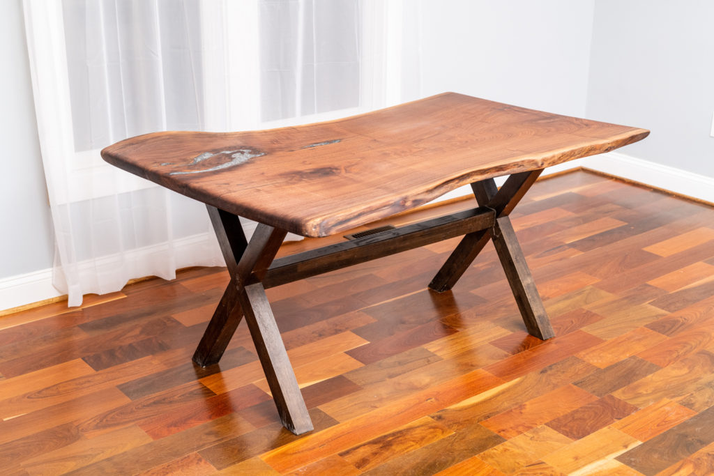 small finished wood slab table on display